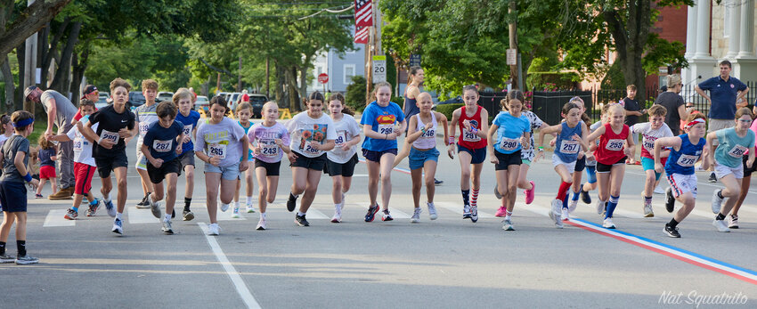 The 10-12 age group takes off to start their 1-mile race.