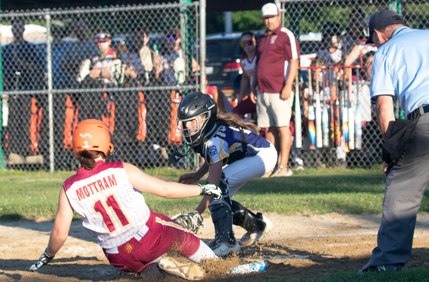 Barrington catcher Molly O&rsquo;Connell tags out a Tiverton baserunner at home plate during the District 2 Championship game on Monday, July 1.