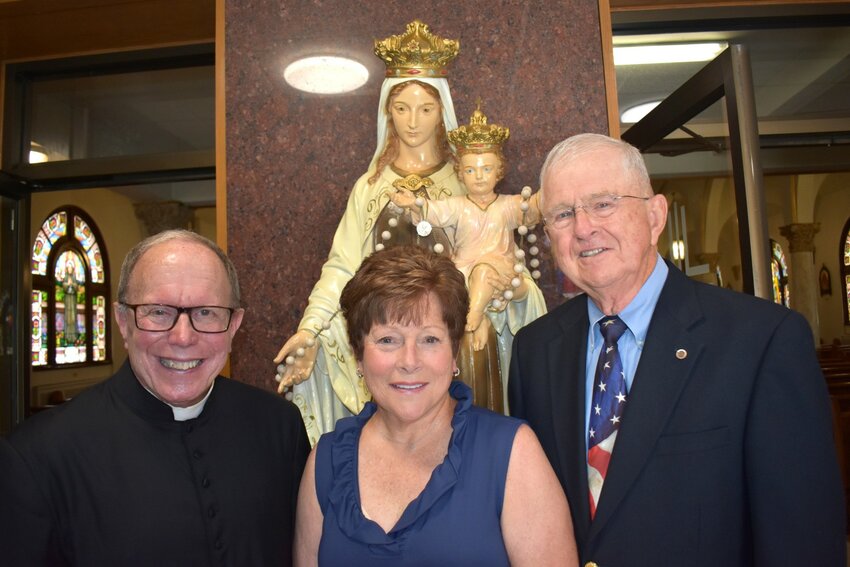 The Rev. Henry P. Zinno Jr. (left) pictured with this year's Our Lady of Mt. Carmel Church Feast Chief Marshals Debbie and Bill Henrich.