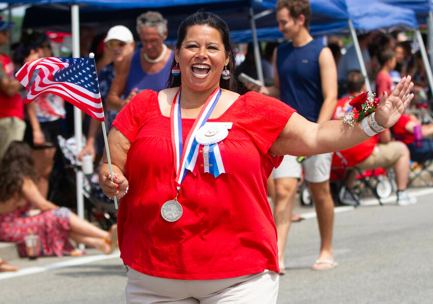 July Fourth Committee General Chairman, Camille Teixeira, marches in the parade on July 4, 2024.