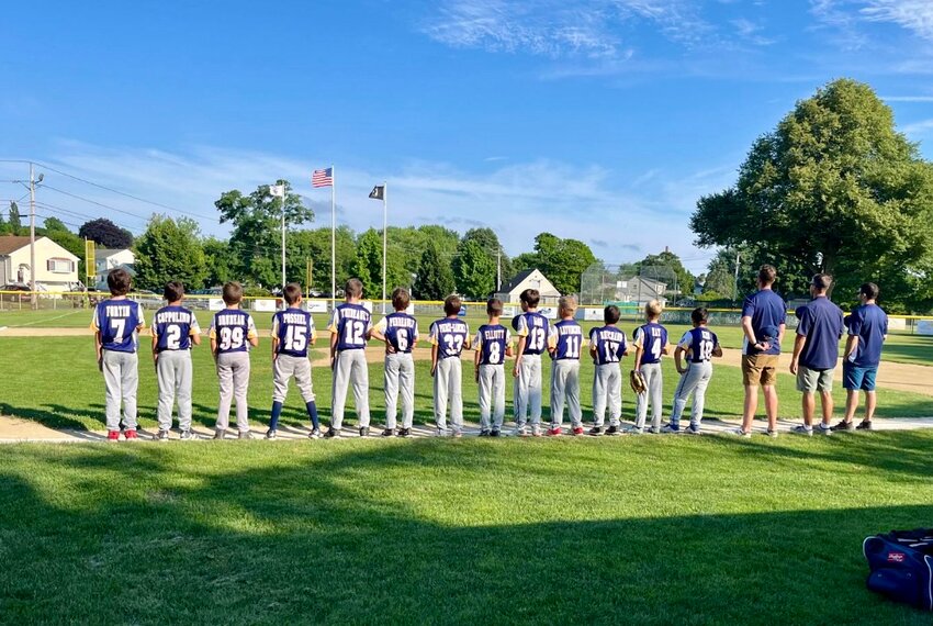 Members of the Barrington Little League Ron Silva Tournament team line up for the National Anthem prior to the start of Tuesday&rsquo;s game in Bristol.