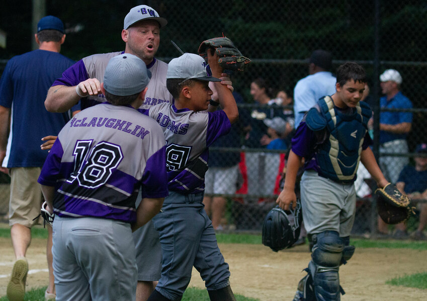 Bristol/Warren players and coaches react after jackson Adams halts a big inning for Barrington with his play in the field. Bristol/Warren won the game 9-3. The two teams play for the title tonight, Saturday July 13.