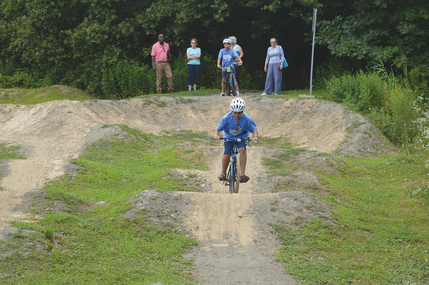 Bike Newport campers showed off their bike skills on the Big Blue Bike Barn&rsquo;s &ldquo;Pump Track.&rdquo;
