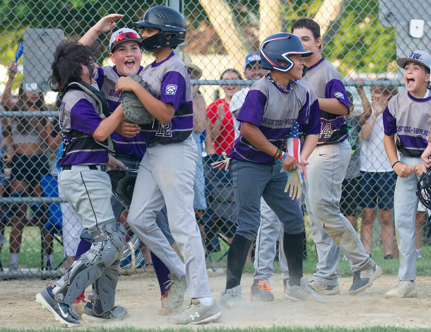 Gavin Labolita (left) Louie Botelho celebrate with Preston DeSousa (mid-left) and Jackson Adams after DeSousa homered in the fifth inning.