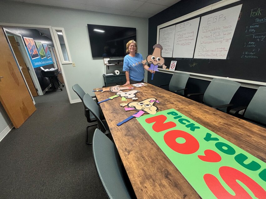 Rebecca Elwell, executive director of Strategic Prevention Partnerships, stands next to the conference table where staff members collaborate &mdash;&nbsp;as they did on the &ldquo;Pick Your No&rsquo;s&rdquo; program. She&rsquo;s hoping to hire a new prevention coordinator for Portsmouth by Oct. 1. &ldquo;I&rsquo;m looking for somebody who has a real passion for the community,&rdquo; she said.