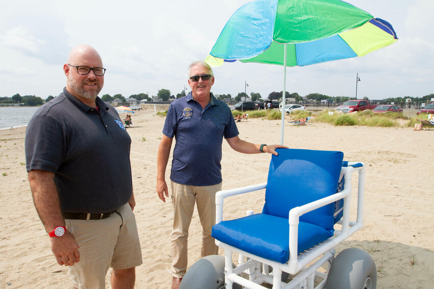 Tiverton Recreation Commission chairman Stu Gilfillen and Rep. John G. Edwards check out one of the town's new beach wheelchairs late last week.