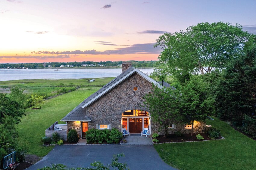 Converted from an historic barn into a residence in the 1950s, this Rumstick Point home went through a complete gutting and renovation 11 years ago. A collaboration between owners and builders created a modern space that still pays homage to its origins.