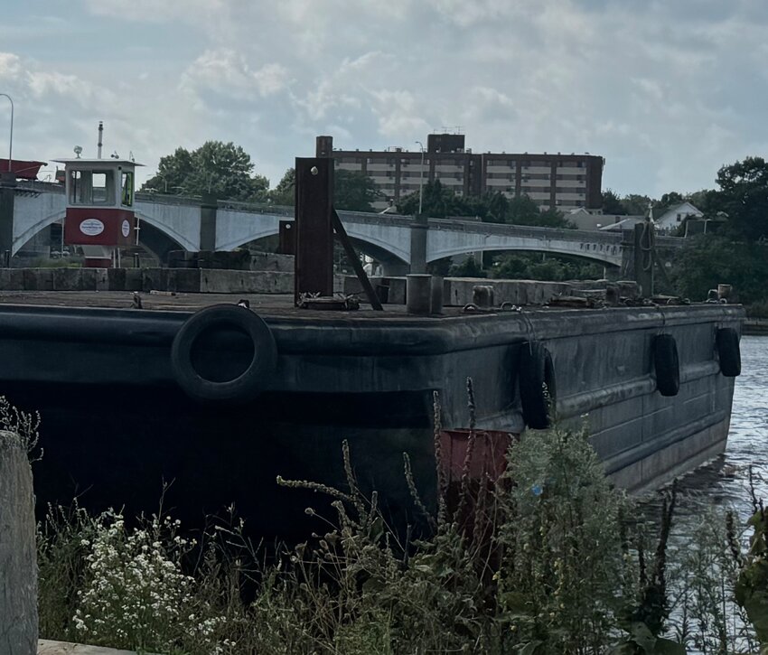 Barges have been docked on the East Providence shoreline at Water Street in preparation for the start of razing the westbound side of the Washington Bridge.