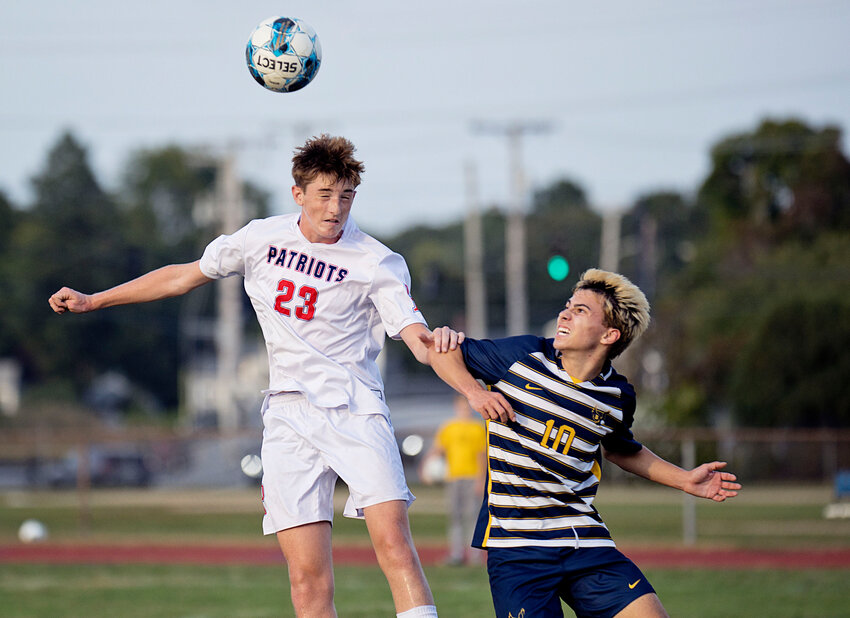 Portsmouth High&rsquo;s Jack Casey wins a head ball against his Barrington opponent at midfield during a contest Tuesday night, Sept. 17.