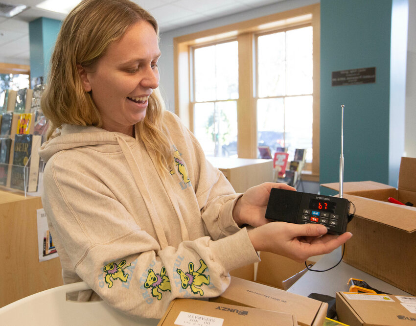 Sarah Griffin, youth services librarian at Rogers Free Library in Bristol, shows off a ghost-hunting kit available for checkout.