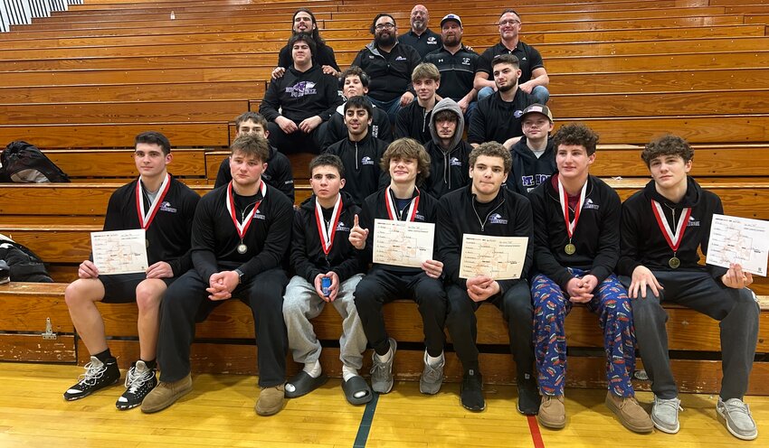The Mt. Hope High wrestlers and coaches gather after the Huskies won four solo titles and the team placed third at the New Bedford Whalers Invitational Saturday, Jan. 25.