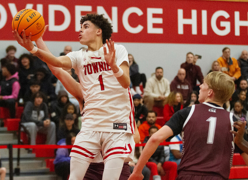 Tyler Gomez leaps through the lane for a layup in the fourth quarter of the Townies loss to LaSalle at home on Friday night.&nbsp;