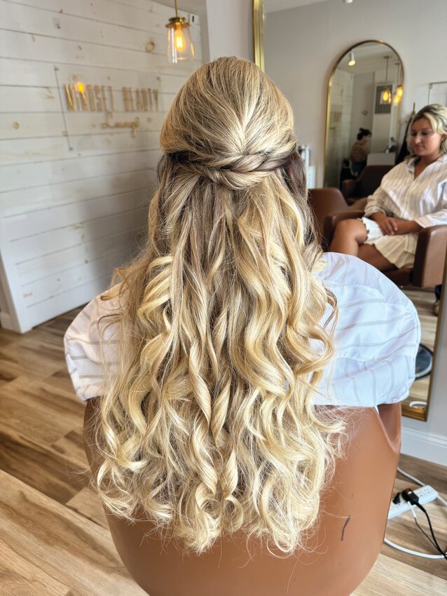 Janelle Traynor adds soft waves to a soon-to-be bride (Nikola Francis) to create this free-flowing look.