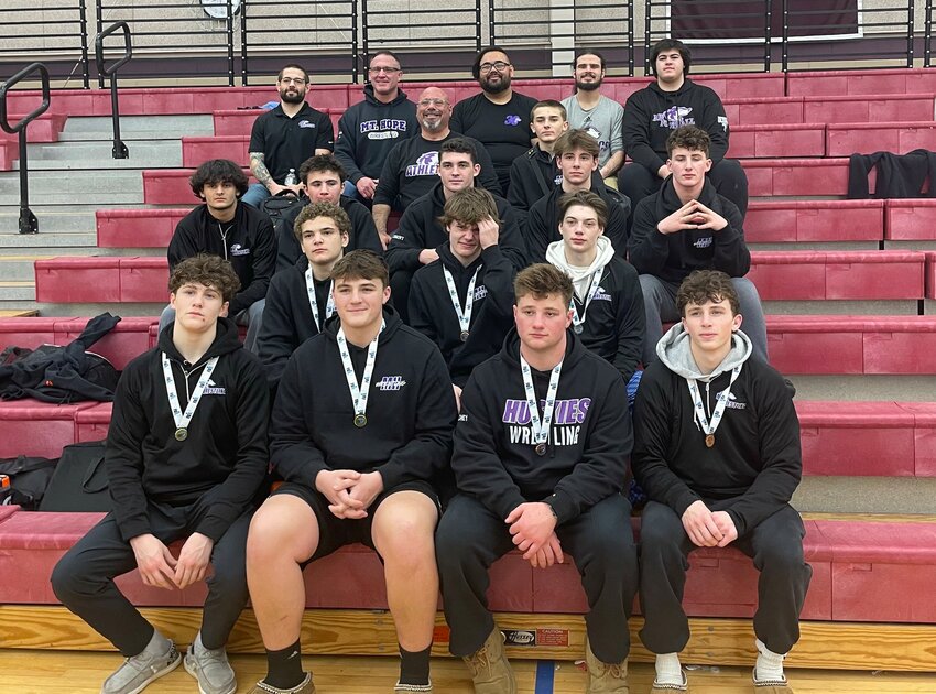 Athletes and coaches from the Mt. Hope High School wrestling team gather after placing second at the inaugural &quot;Red and Green&quot; state meet qualifying tournament held last weekend at LaSalle Academy in Providence.