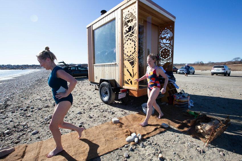 Kayla Sibilia sets up her mobile sauna at South Shore Beach and, when conditions aren&rsquo;t good, at Sakonnet Point. Above, Chrissy Collins (left) and Julia Bush head for the water.