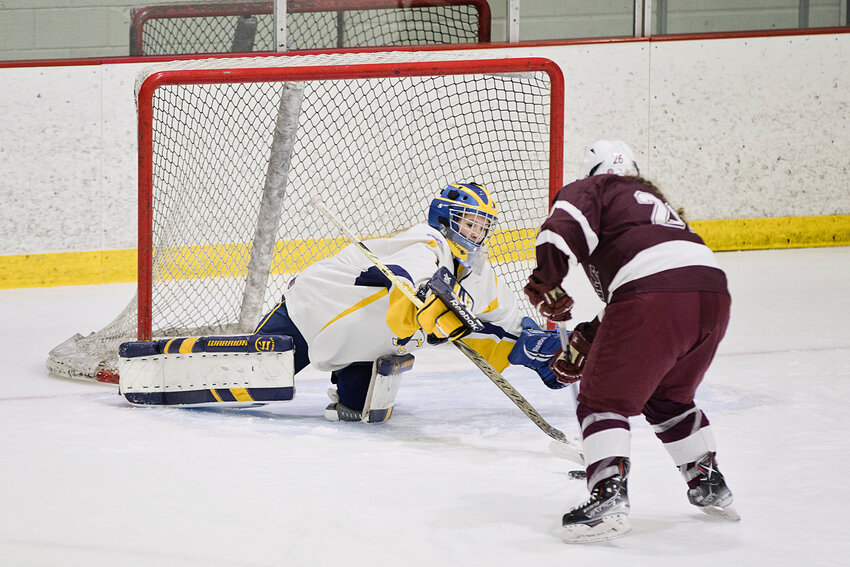 Goalie Natalie Albritton, one of three Mt. Hope members of the East Bay Eagles girls' hockey co-op, makes a save for the locals during a game earlier this winter. The Eagles face the Northern R.I. co-op in the opening round of the 2025 state playoffs.