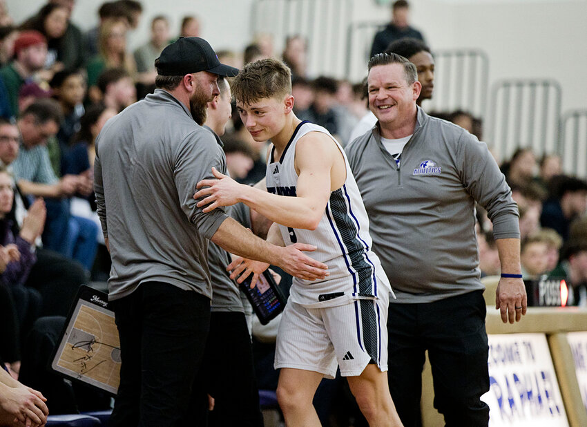 The Mt. Hope High School boys' basketball team celebrates its Division III semifinal playoff win over Ponaganset Thursday night, Feb. 27.