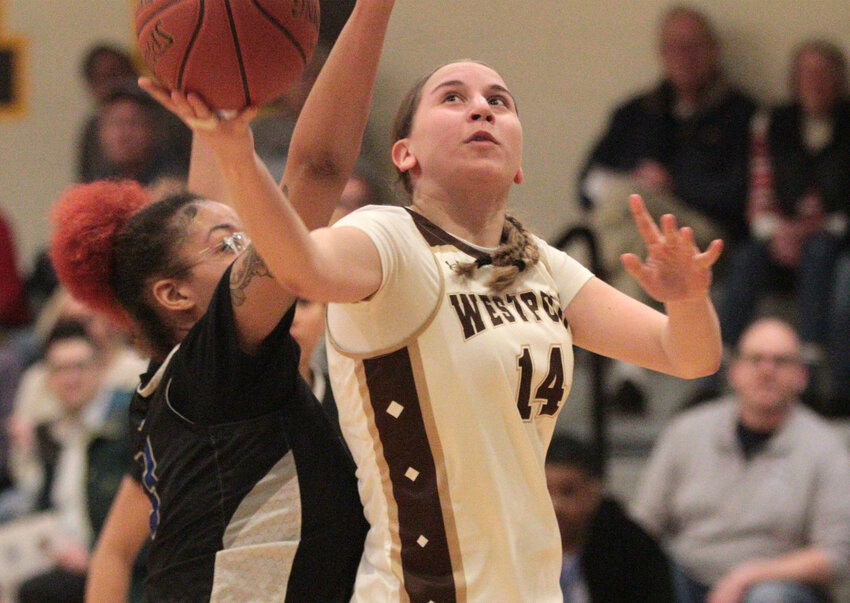 Skylar Rezendes drives in for a layup.&nbsp;The sophomore forward scored a game high 15 points as Westport beat Neighborhood House 46-23 in the D-5 round of 32.