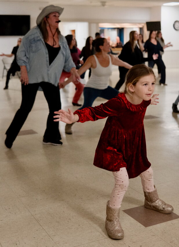 Atlas Gunneman, 6, was the youngest participant in a line dancing class hosted by the Portsmouth Recreation Department at the Knights of Columbus in Middletown last week. In the background is Wendy Bulk (left), Portsmouth&rsquo;s director of parks and recreation who was leading the class, and Atlas&rsquo;s mom, Stefanie Gallo.