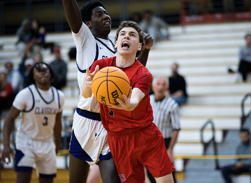 Portsmouth High&rsquo;s Kyle Bielawa throws up a shot from under the hoop against Classical during their &ldquo;Elite Eight&rdquo; matchup at Rhode Island College Tuesday night. Classical eliminated the Patriots from the state championship tournament with an 87-49 win.
