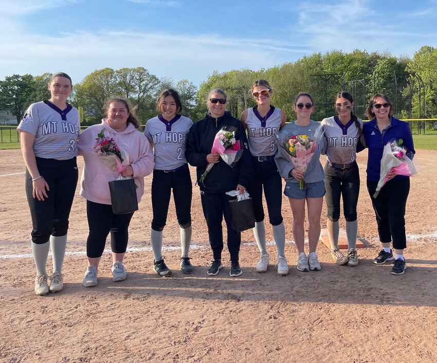 Mt. Hope High School head softball coach Lis Braun (center) last spring with team members in the senior class of 2024.