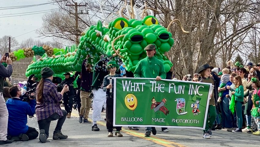 If not for a single popped balloon, this 89-foot dragon would have been a foot longer than the parade itself. Either way, it impressed the judges enough to award it first place in this year's float contest.