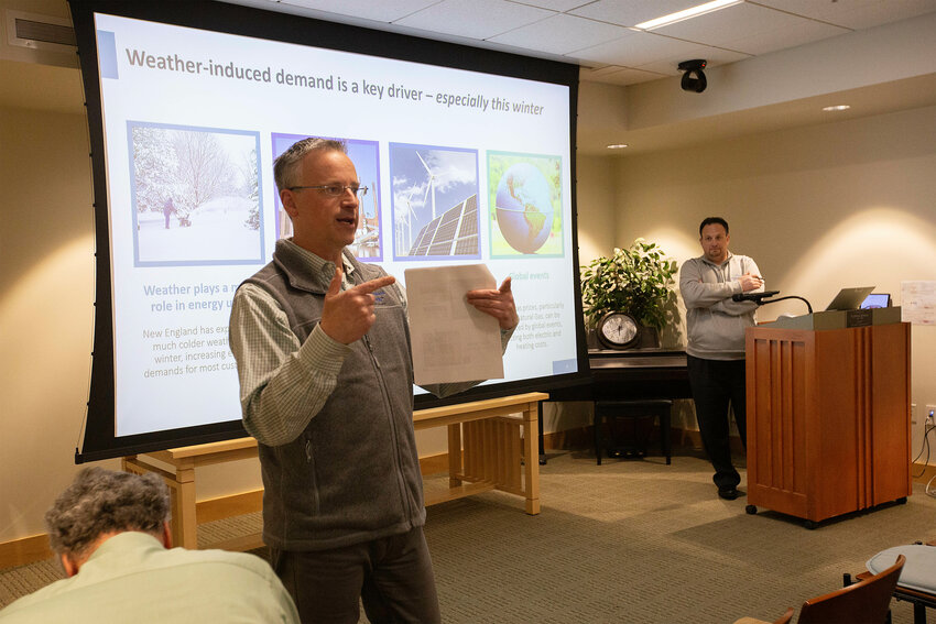 Brian Schuster, head of external affairs for Rhode Island Energy, talks to a crowd of, at times, agitated audience members during a public forum about rising energy costs this winter.