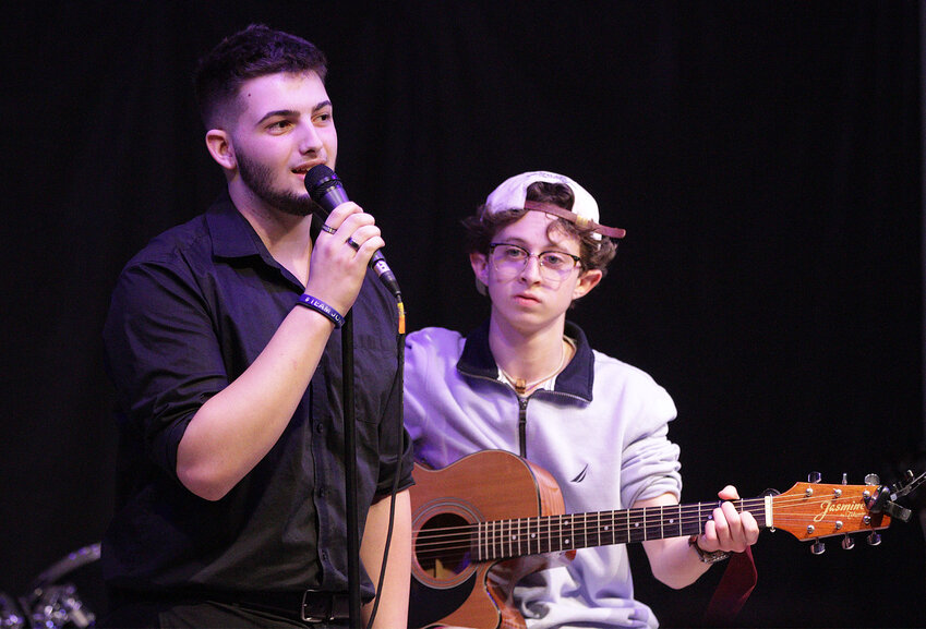 Zak Suman and Nate Calouro perform Stick Season by Noah Kahan during Mt. Hope High School's Musicafe on Thursday.