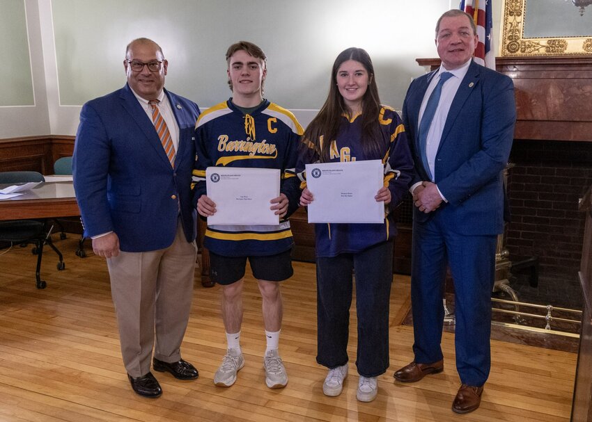 Dozens of high school ice hockey players received Hobey Baker awards recently. Pictured are (from left to right) Senator David Tikoian, Barrington&rsquo;s Cody Wood, Portsmouth&rsquo;s Margaux and Representative Stephen Casey, during the special ceremony at the Rhode Island Statehouse.