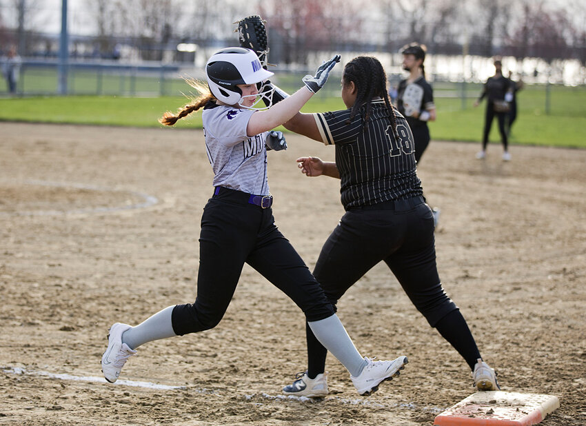 Macie Comeau strides towards the bag for the Mt. Hope High School softball team in its recent outing against Davies Voc.