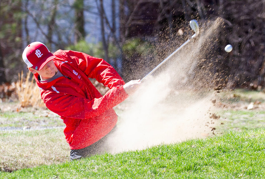 Parker Andrews blasts the ball out a fairway bunker during a practice round.&nbsp;