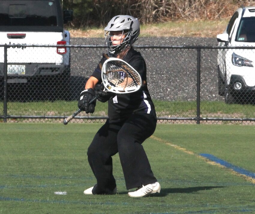 Mt. Hope High girls' lacrosse goalie Nadia Albritton readies to make a save for the Huskies in their Division II outing against the Lincoln School Wednesday, April 23.