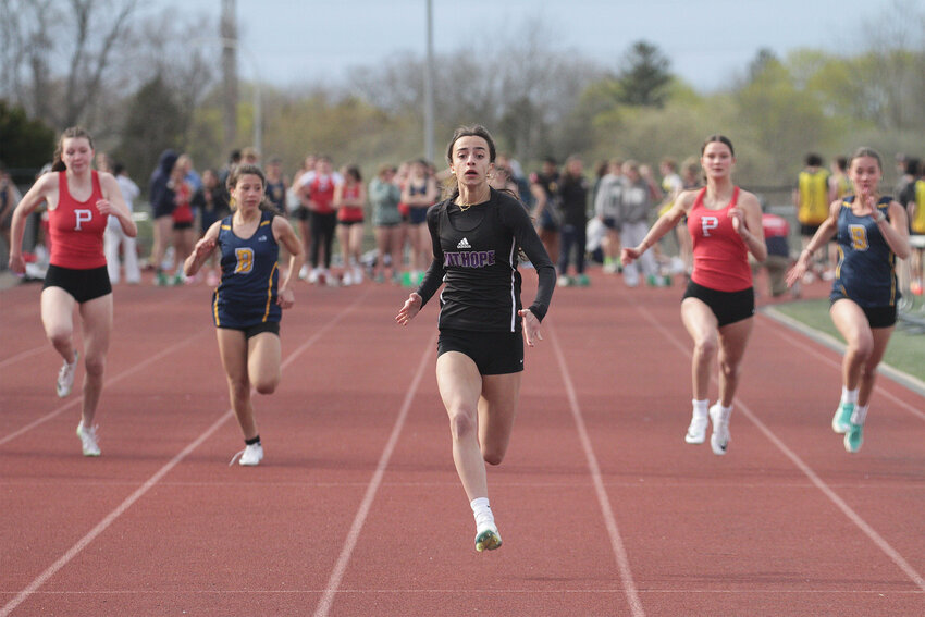 Mt. Hope's Thea Jackson (center) broke her own school outdoor record in the girls' 100 meters during a recent invitational meet in West Warwick.