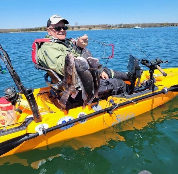 Kayak angler Tom Houde with a string of three tautog, his limit, caught in spring two years ago.&nbsp;