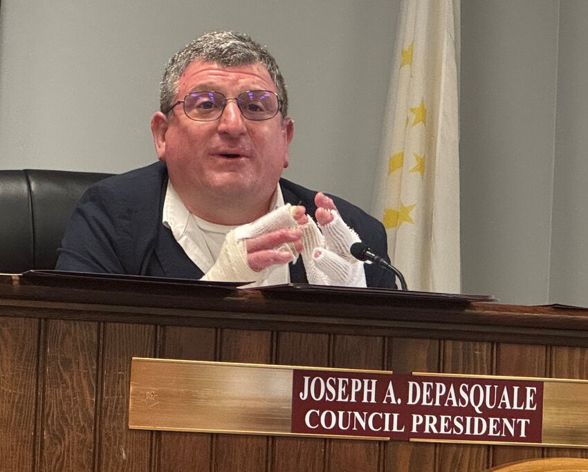 With the signs of his recent accident quite evident, Warren Town Council President Joseph DePasquale addresses the audience at the body's May 13 meeting.