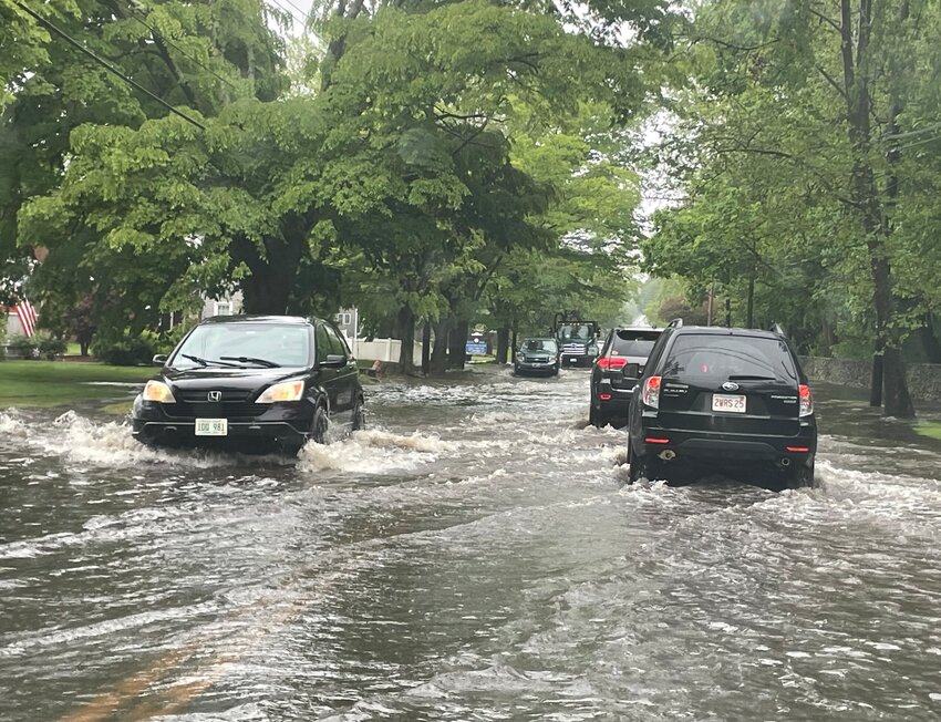 Downpours overwhelmed south Main Street at the Warren-Bristol town border Thursday morning, May 15.