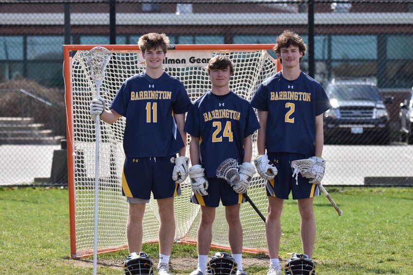 Barrington High School boys lacrosse team seniors (from left to right) Ryan Owens, Nick Spaight, and Ben Parylak pose for a photo on senior night.