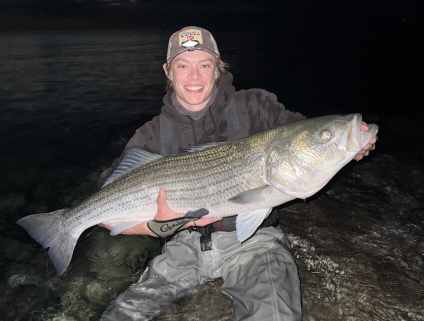 Grant Stark with the 46&rdquo; striped bass he caught on Cape Cod last week. Photo courtesy of &lsquo;My Fishing Cape Cod&rsquo;.