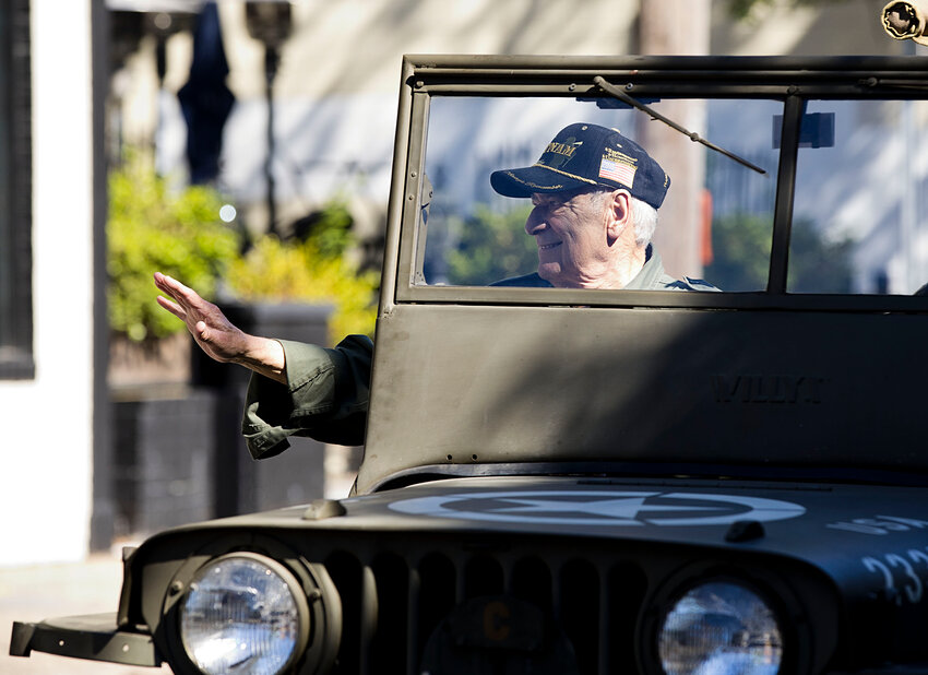 Retired Warren Fire Department Chief and United States Navy Vietnam veteran Al Galinelli (left) waves to the watchers of the Memorial Day Parade held Monday, May 26.