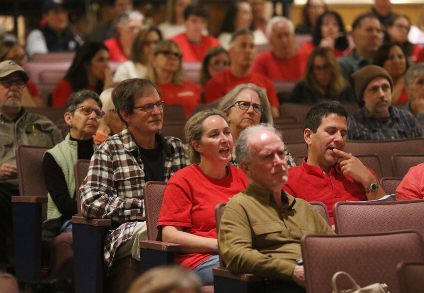 People supporting local teachers and teacher assistants wore red shirts to the FTM on Wednesday night.