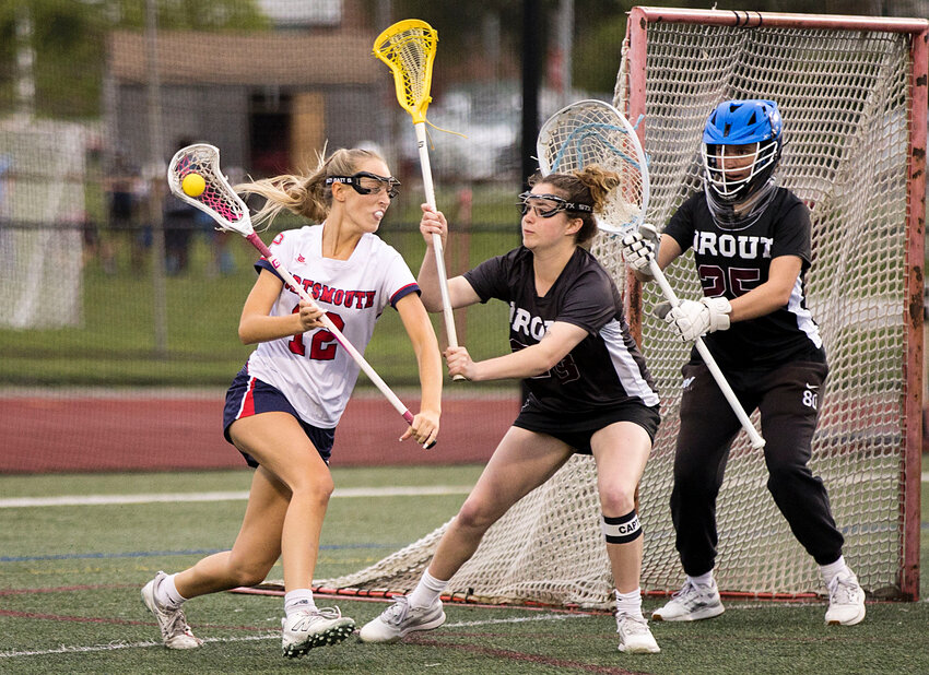 Sophia Sebolt cuts toward the goal to score for the Patriots in the first half of Thursday&rsquo;s quarterfinal lacrosse game. Portsmouth was triumphant in the end, 17-16.