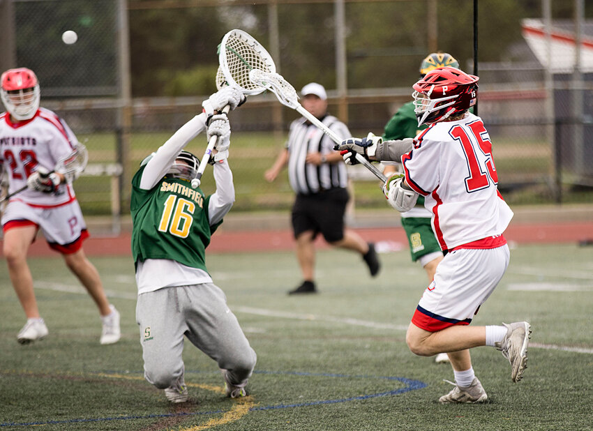 The Patriots&rsquo; Shane Temple fires a shot over the Smithfield goalie during Friday&rsquo;s 18-8 quarterfinal win in Division II boys&rsquo; lacrosse. Temple was Portsmouth&rsquo;s top scorer, with five goals.