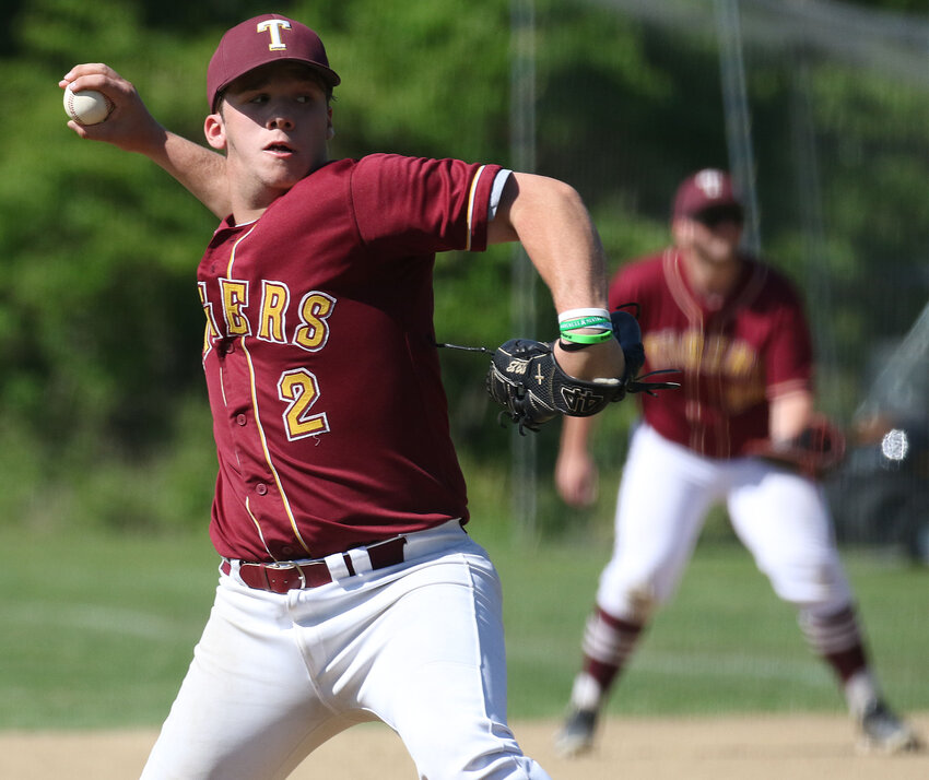 Senior Kam Rego hurls a pitch during the game. The ace struck out 7 and allowed 5 hits, a walk and 2 runs in 4 innings of work.