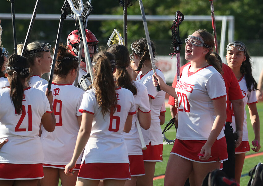 Kloey Iacovone (right) rallies the Townies between quarters during their semifinals matchup against Toll Gate.