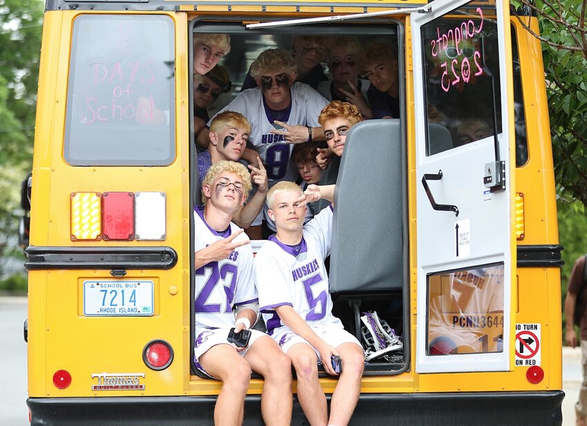 The Mt. Hope High School boys' lacrosse players waited patiently on their team bus Saturday, June 7, during a severe weather delay that eventually led to the postponement of their league championship game against Narragansett to Monday, June 9.