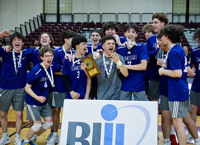 The Mt. Hope High School boys' volleyball celebrates winning the Division III championship over Portsmouth, 3-2, Saturday night, June 7, at Rhode Island College.