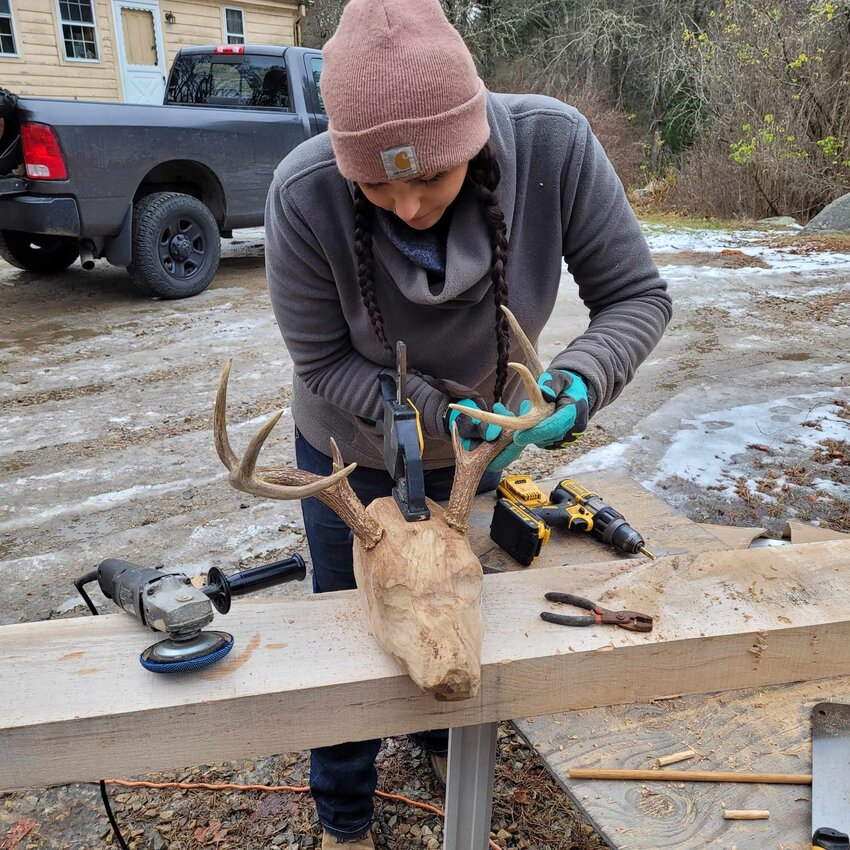 Brooke Waldron, Wampanoag and Narragansett descent, works on her sculpture, &ldquo;Attuck the Sentinel,&rdquo; now installed in Awashonks&rsquo; Garden.