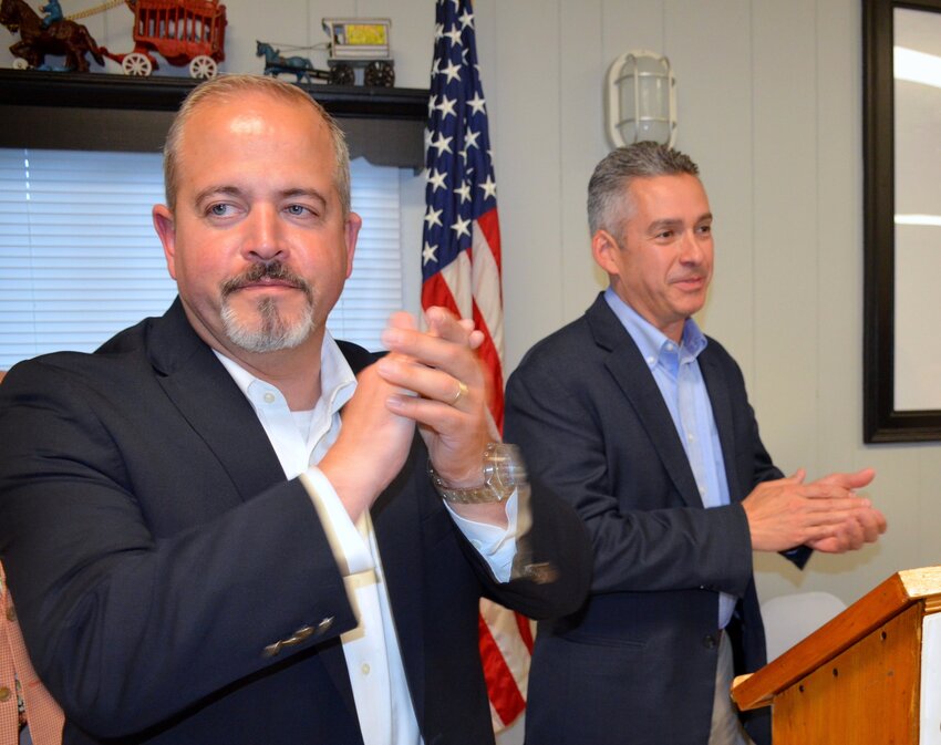 Town Council Chairman Nathan Calouro (left) and Town Administrator Steve Contente lead the cheers during Saturday's Cup Defenders Association 90th anniversary celebration.