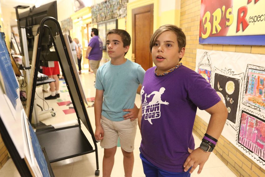 Guiteras School fifth grader Jacoby Cabral (right) speaks about his experience at Guiteras (favorite classes: PE and math). &quot;I think that the history of the school building and classrooms is really cool and I'm super sad that it will be shutting down.&quot; Fifth grader Jonathan Banville is on the left.&nbsp;