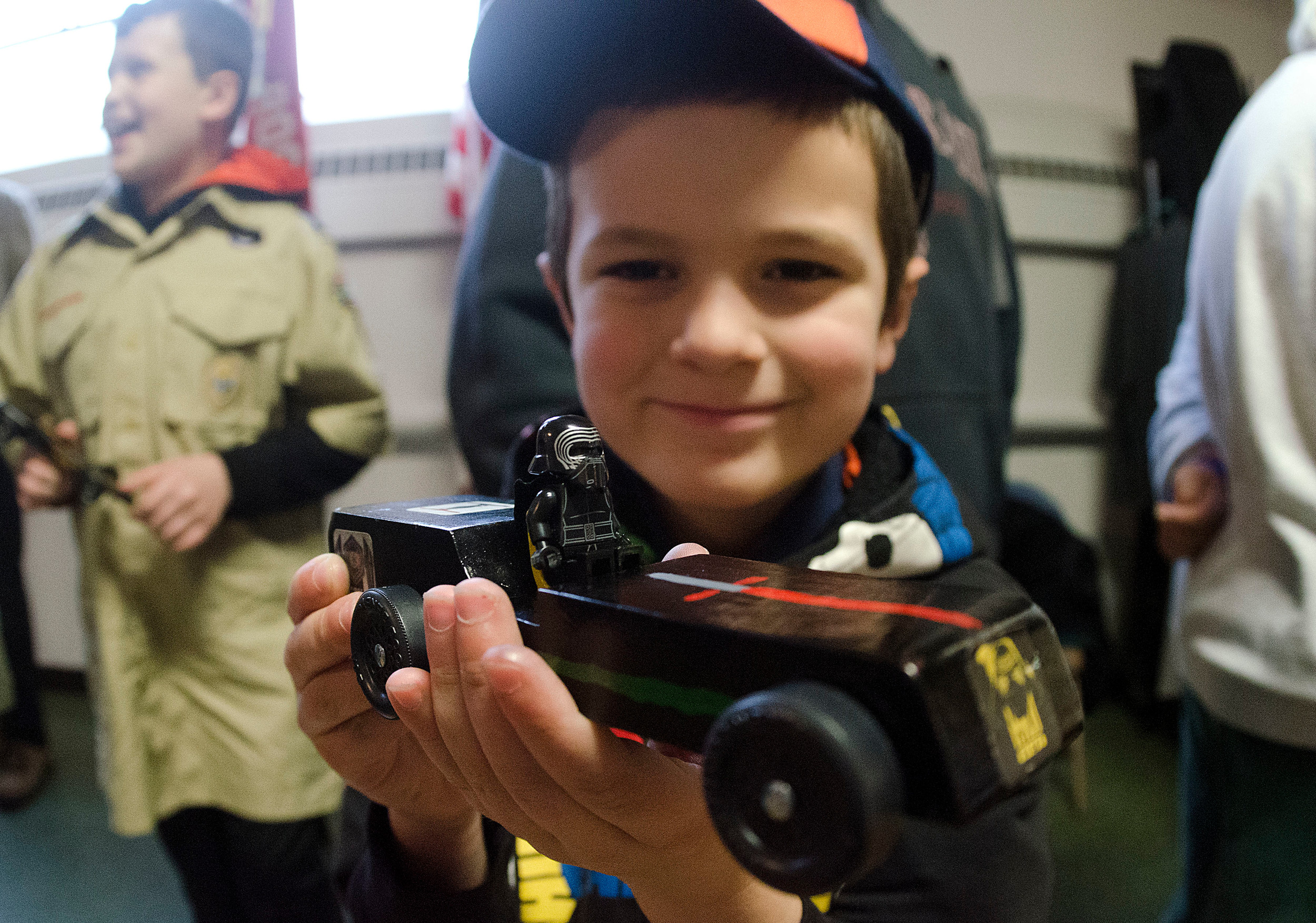 Gavin Courville of Pack 82 Portsmouth displays his Darth Vader car.